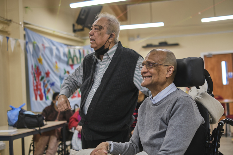 Man in wheelchair with carer