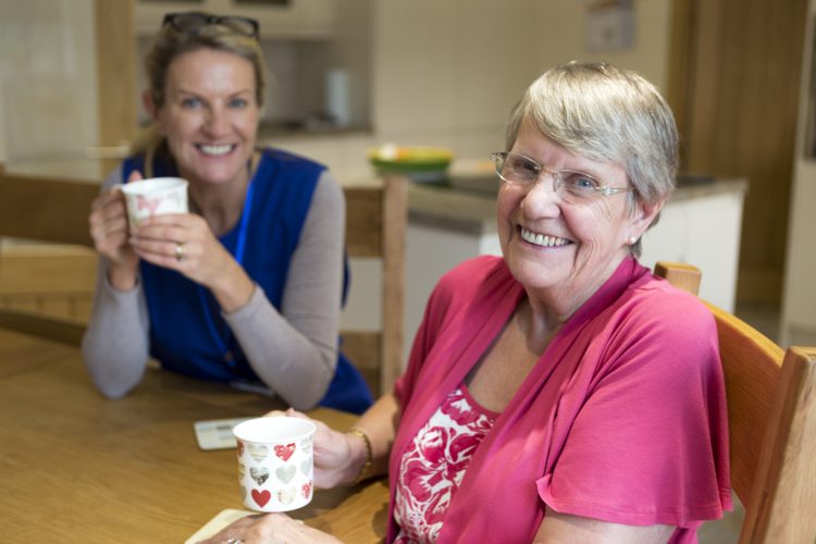 Elderly lady with carer