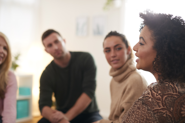 Woman speaking at support group