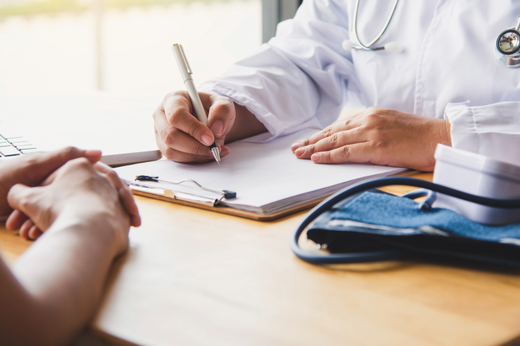 hands of a patient speaking with doctor